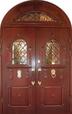 Стальная арочная дверь со стеклом и ковкой ДА-30 в дом из кирпича в Мытищах