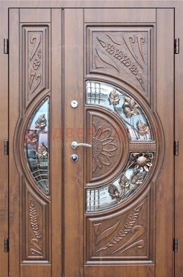 Уличная дверь в цвете Итальянский орех с виноритом и ковкой со стеклом ДВТ-147 в Мытищах